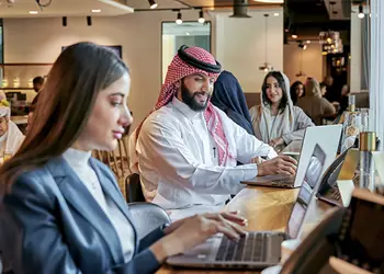In a vibrant Servcorp coworking space in Saudi Arabia, professionals connect and thrive in a dynamic environment designed for productivity and collaboration.